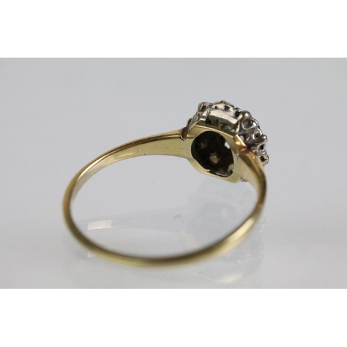 50 - Early 20th Century diamond cluster ring. The ring being set with an old round cut diamond to centre ... 