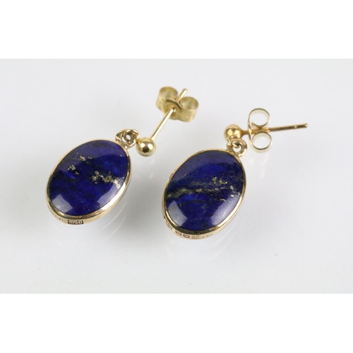 52 - 9ct and lapis lazuli necklace, bracelet and earrings. The bracelet set with seven lapis lazuli caboc... 