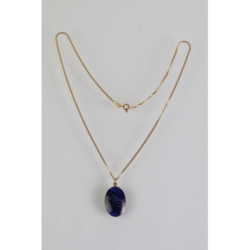 52 - 9ct and lapis lazuli necklace, bracelet and earrings. The bracelet set with seven lapis lazuli caboc... 