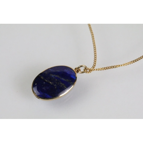 52 - 9ct and lapis lazuli necklace, bracelet and earrings. The bracelet set with seven lapis lazuli caboc... 