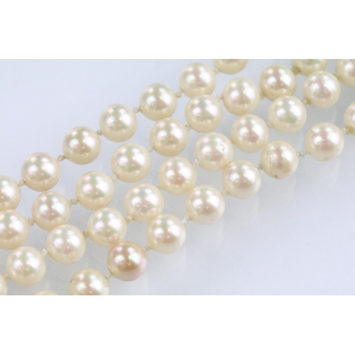 57 - Christian Dior - Four strand simulated pearl necklace having a white stone set clasp with half pearl... 