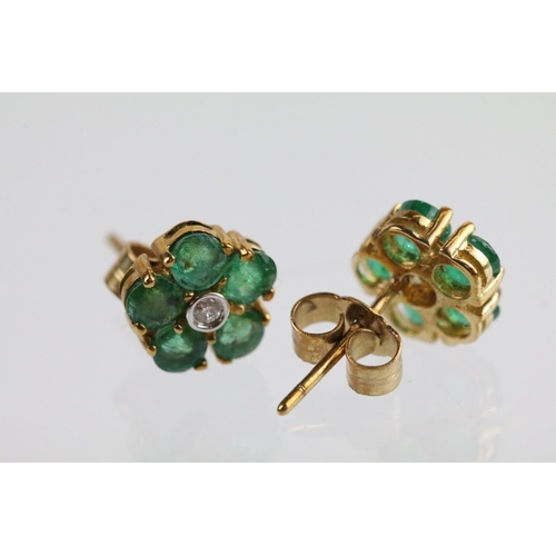 58 - Pair of 9ct gold emerald and diamond cluster earrings. The earrings set with a round cut diamond to ... 