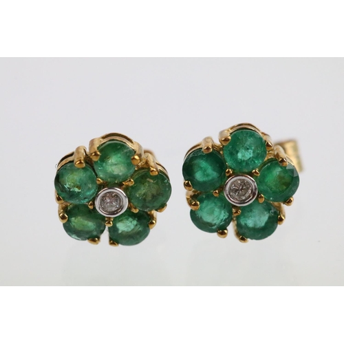 58 - Pair of 9ct gold emerald and diamond cluster earrings. The earrings set with a round cut diamond to ... 