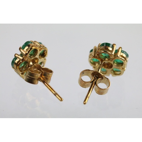 58 - Pair of 9ct gold emerald and diamond cluster earrings. The earrings set with a round cut diamond to ... 