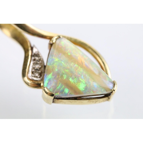 61 - 18ct gold opal and diamond pendant being set with a polished triangular opal displaying a full spect... 