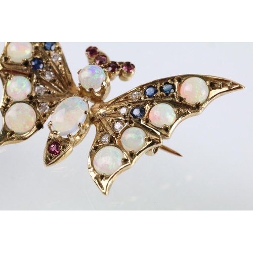 7 - 9ct gold hallmarked opal, diamond, sapphire and ruby butterfly brooch. The brooch set with with two ... 