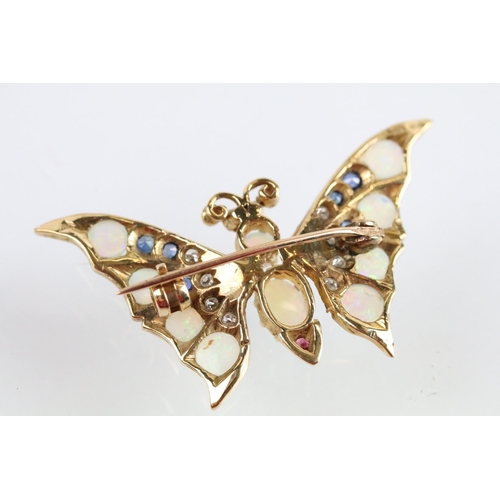 7 - 9ct gold hallmarked opal, diamond, sapphire and ruby butterfly brooch. The brooch set with with two ... 