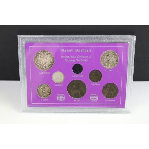 101 - A collection of eight cased coin sets to include King Edward VII penny set, Queen Victoria penny set... 