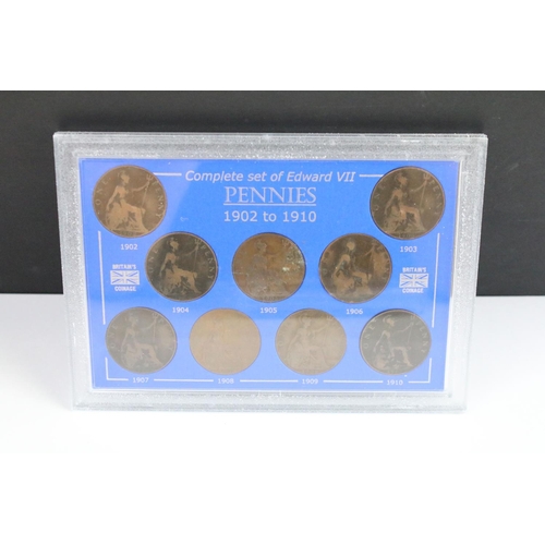 101 - A collection of eight cased coin sets to include King Edward VII penny set, Queen Victoria penny set... 