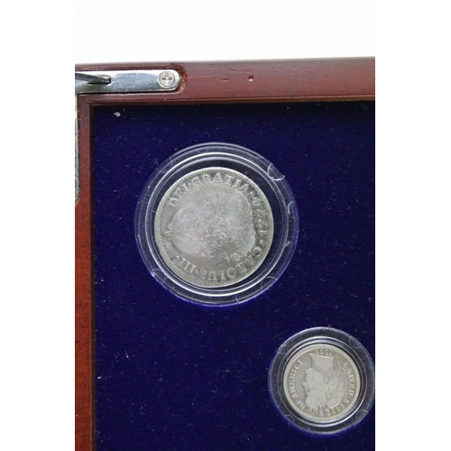 102 - A set of early american silver coins encapsulated within wooden fitted display case.