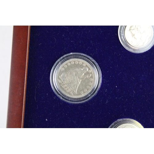 102 - A set of early american silver coins encapsulated within wooden fitted display case.