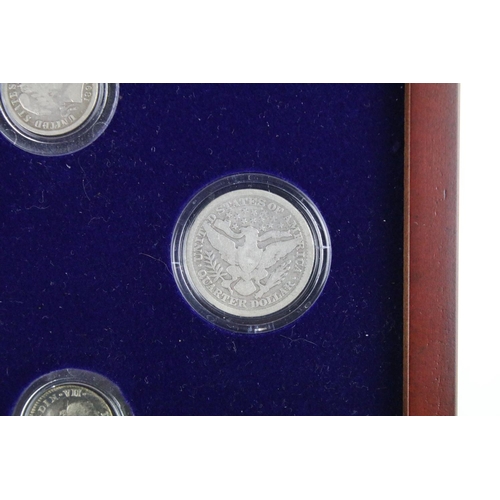 102 - A set of early american silver coins encapsulated within wooden fitted display case.