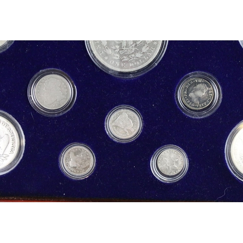 102 - A set of early american silver coins encapsulated within wooden fitted display case.