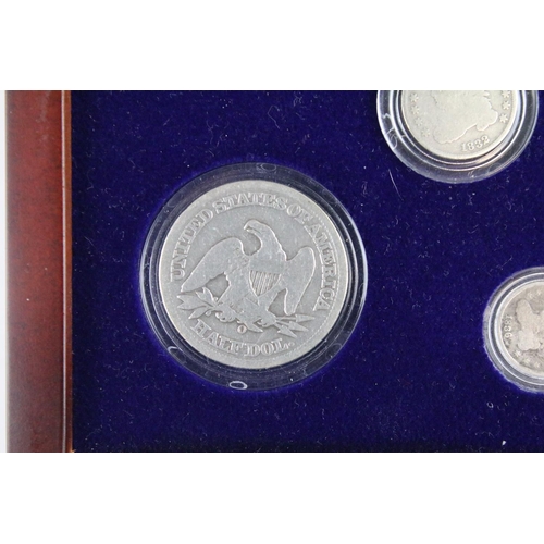 102 - A set of early american silver coins encapsulated within wooden fitted display case.