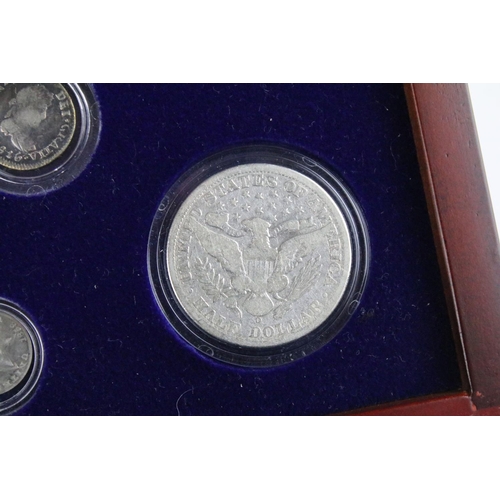 102 - A set of early american silver coins encapsulated within wooden fitted display case.