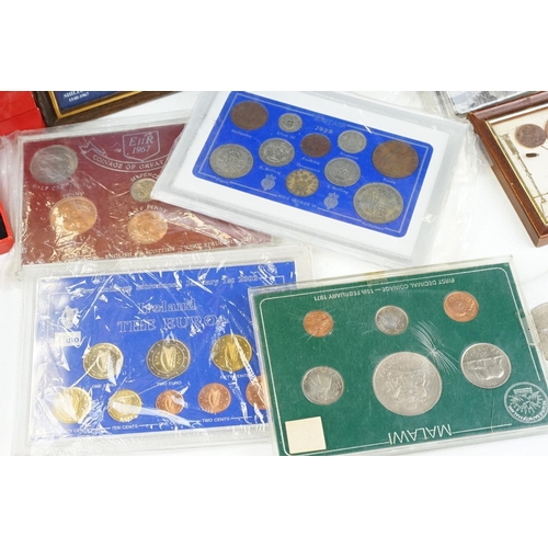 127 - A collection of mixed coins to include commemorative crowns, coin packs...etc.. to include silver ex... 