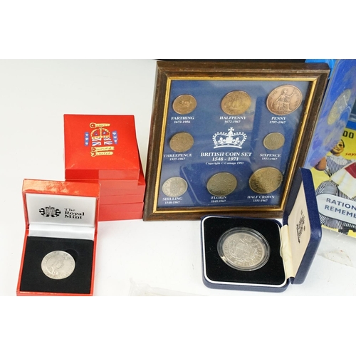 127 - A collection of mixed coins to include commemorative crowns, coin packs...etc.. to include silver ex... 