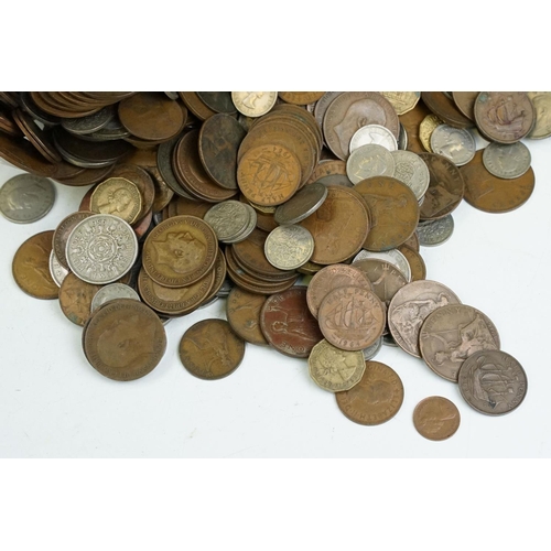 23 - A large collection of British pre decimal coins to include pennies, half pennies, threepences, shill... 