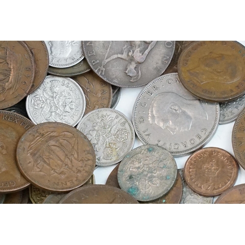 23 - A large collection of British pre decimal coins to include pennies, half pennies, threepences, shill... 