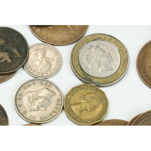 23 - A large collection of British pre decimal coins to include pennies, half pennies, threepences, shill... 