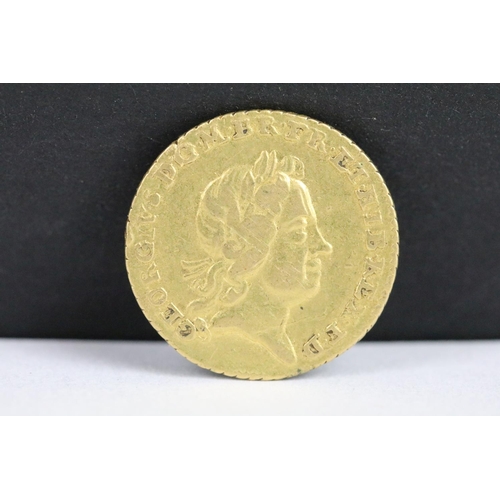 115 - A British King George I 1718 gold quarter guinea coin. (V/F).