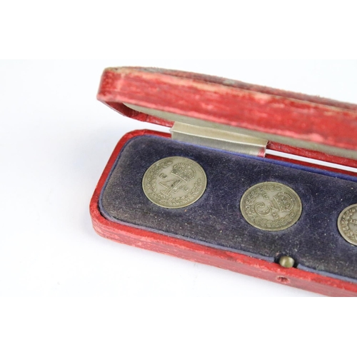 117 - A group of four British silver maundy coins to include 1825, 1835 and 1939 examples within a fitted ... 