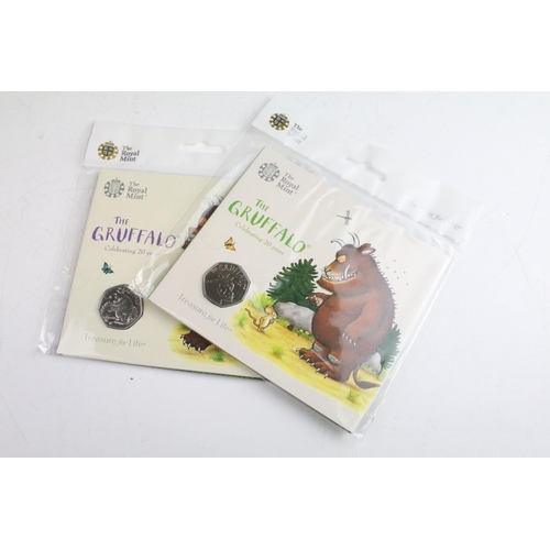 129 - A collection of Eleven Royal Mint uncirculated collectors 50p coin packs to include The Snowman, Inn... 