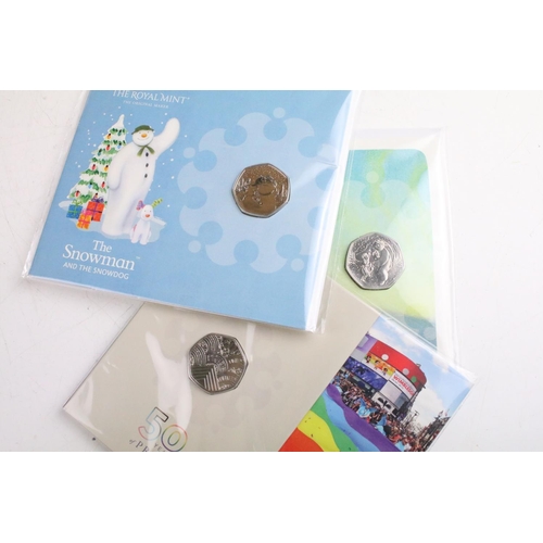 131 - A collection of ten Royal Mint uncirculated collectors 50p coin packs to include The Snowman, 50 Yea... 