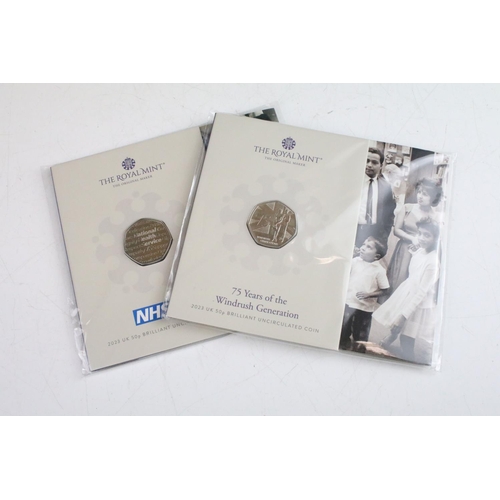 131 - A collection of ten Royal Mint uncirculated collectors 50p coin packs to include The Snowman, 50 Yea... 