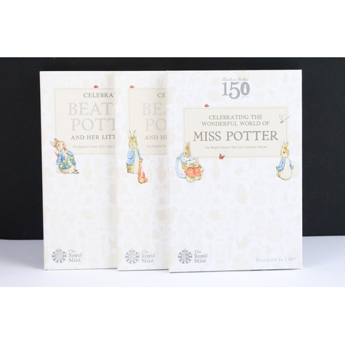 133 - A collection of Beatrix Potter 50p coins within three Royal Mint collectors folders.