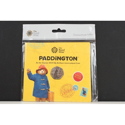 135 - A collection of Royal Mint Paddington Bear coin sets to include 2018 and 2019 examples