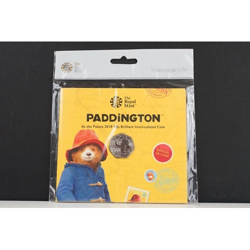 135 - A collection of Royal Mint Paddington Bear coin sets to include 2018 and 2019 examples