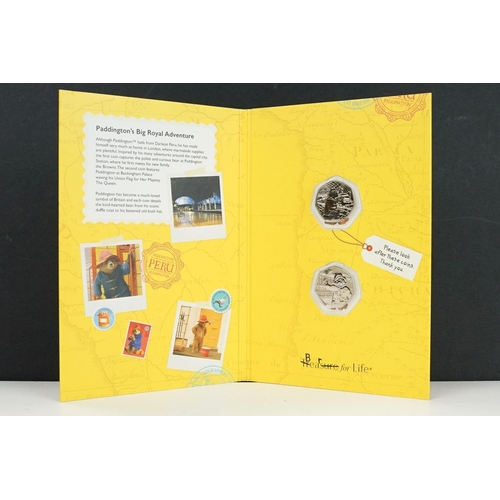 135 - A collection of Royal Mint Paddington Bear coin sets to include 2018 and 2019 examples