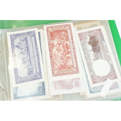 84 - A large collection of British and world banknotes contained within two folders to include a good col... 