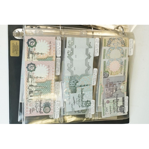 84 - A large collection of British and world banknotes contained within two folders to include a good col... 