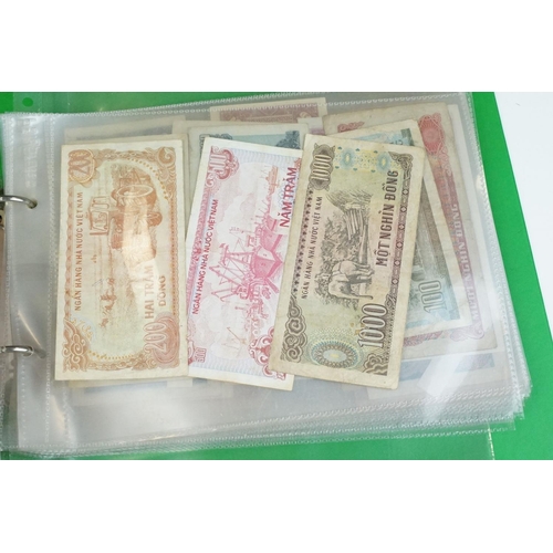 84 - A large collection of British and world banknotes contained within two folders to include a good col... 