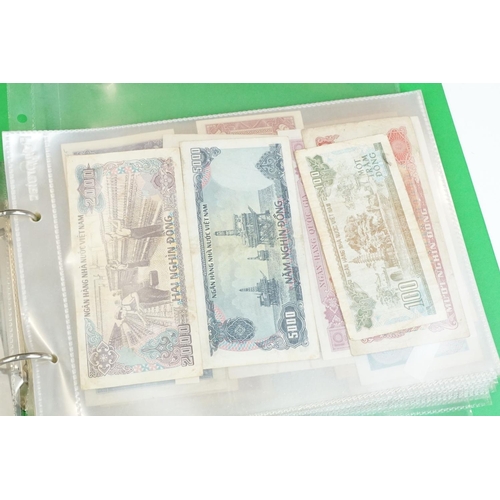 84 - A large collection of British and world banknotes contained within two folders to include a good col... 