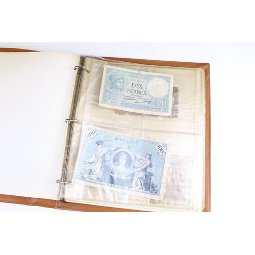 25 - A small collection of British and World banknotes contained within a collectors album.