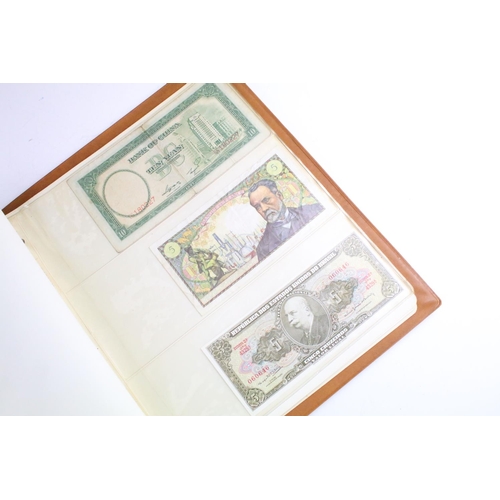 25 - A small collection of British and World banknotes contained within a collectors album.