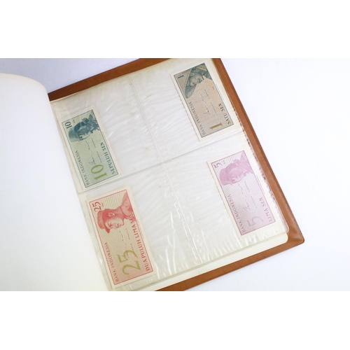 25 - A small collection of British and World banknotes contained within a collectors album.