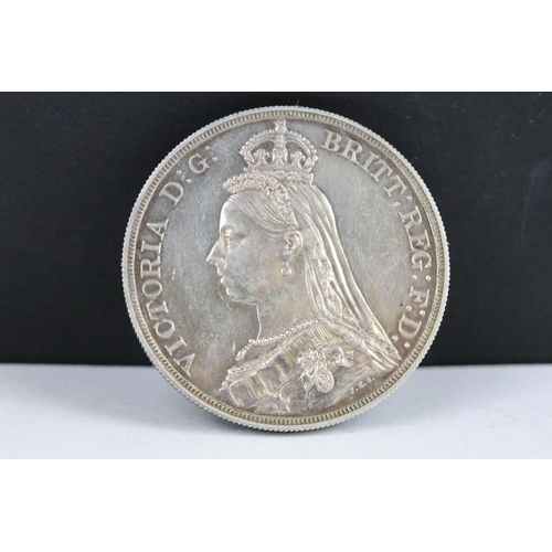 54 - A collection of three British Queen Victoria silver Crown coins to include 1890, 1887 and 1887 examp... 