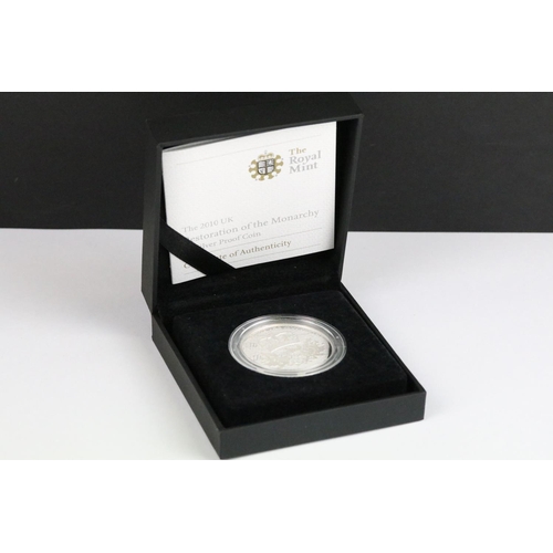 56 - A British Royal Mint 2007 Diamond Wedding silver proof crown coin together with a 2010 Restoration o... 