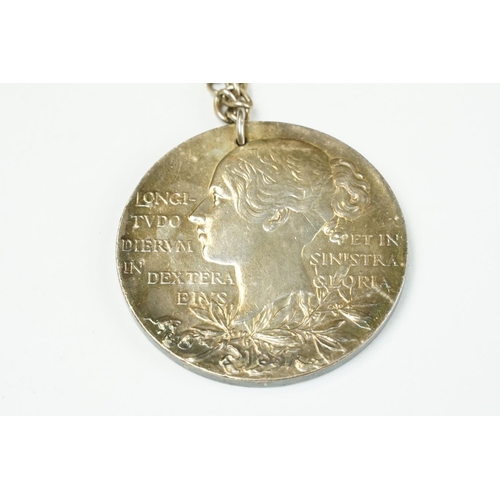 6 - A large Queen Victoria commemorative medallion mounted to white metal chain.