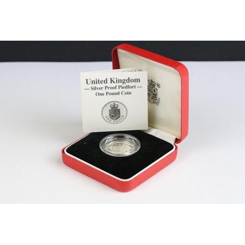 63 - A United Kingdom Royal Mint silver proof Piedfort 1988 £1 coin together with  a 2000 silver proof £5... 