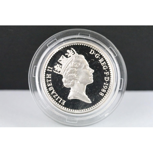 63 - A United Kingdom Royal Mint silver proof Piedfort 1988 £1 coin together with  a 2000 silver proof £5... 