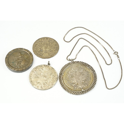 A small collection of four coins to include three 1780 silver Thalers ...