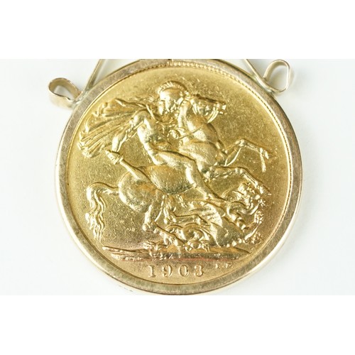 233 - A British King Edward VII 1903 gold full sovereign coin mounted within a 9ct gold mount.