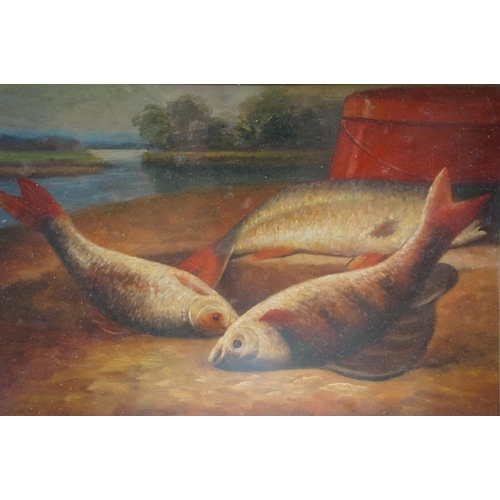 39 - Freshwater fish and creel on a riverbank, oil on board, 17 x 25cm, framed and glazed