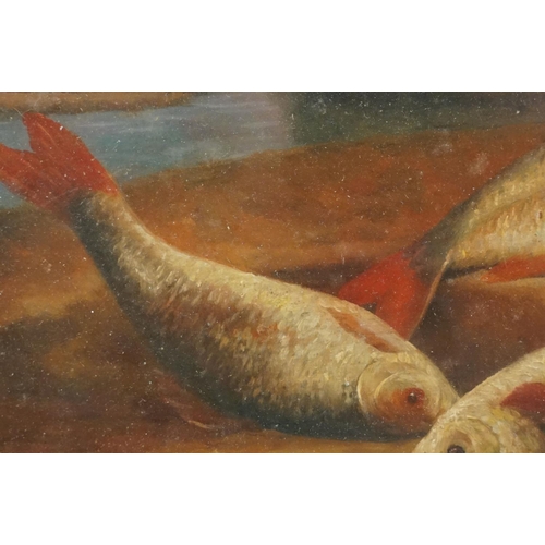 39 - Freshwater fish and creel on a riverbank, oil on board, 17 x 25cm, framed and glazed