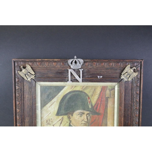 167 - Napoleon oil on canvas painting set within an oak frame with adorned with brass eagles and the lette... 